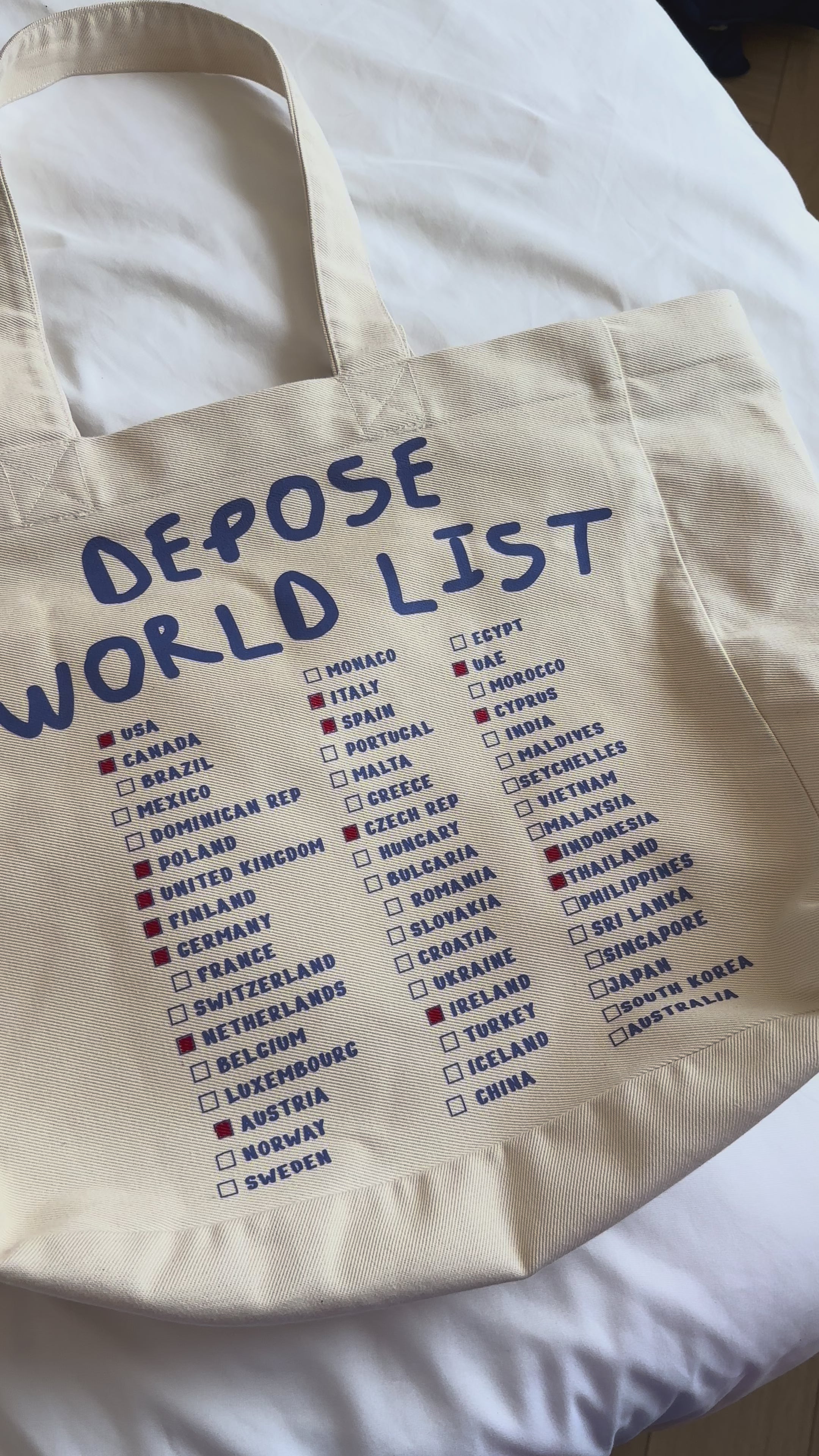 Duża torba z drelichu bawełnianego z listą krajów do odhaczania i napisem DEPOSE